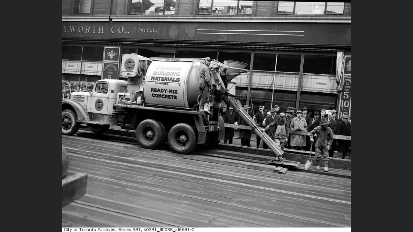 Concrete and Aggregates Supplier in Ontario - historic photo of a Canada Building Materials truck pouring concrete downtown