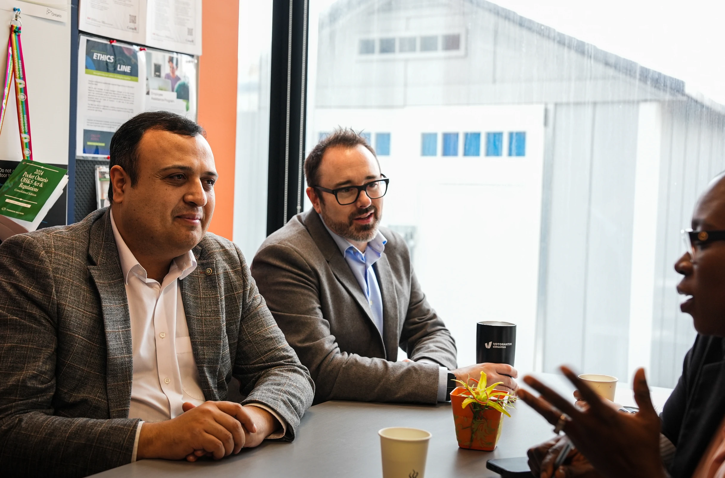 Ready Mix Concrete Supplier in Ontario - team members in conversation around a meeting table